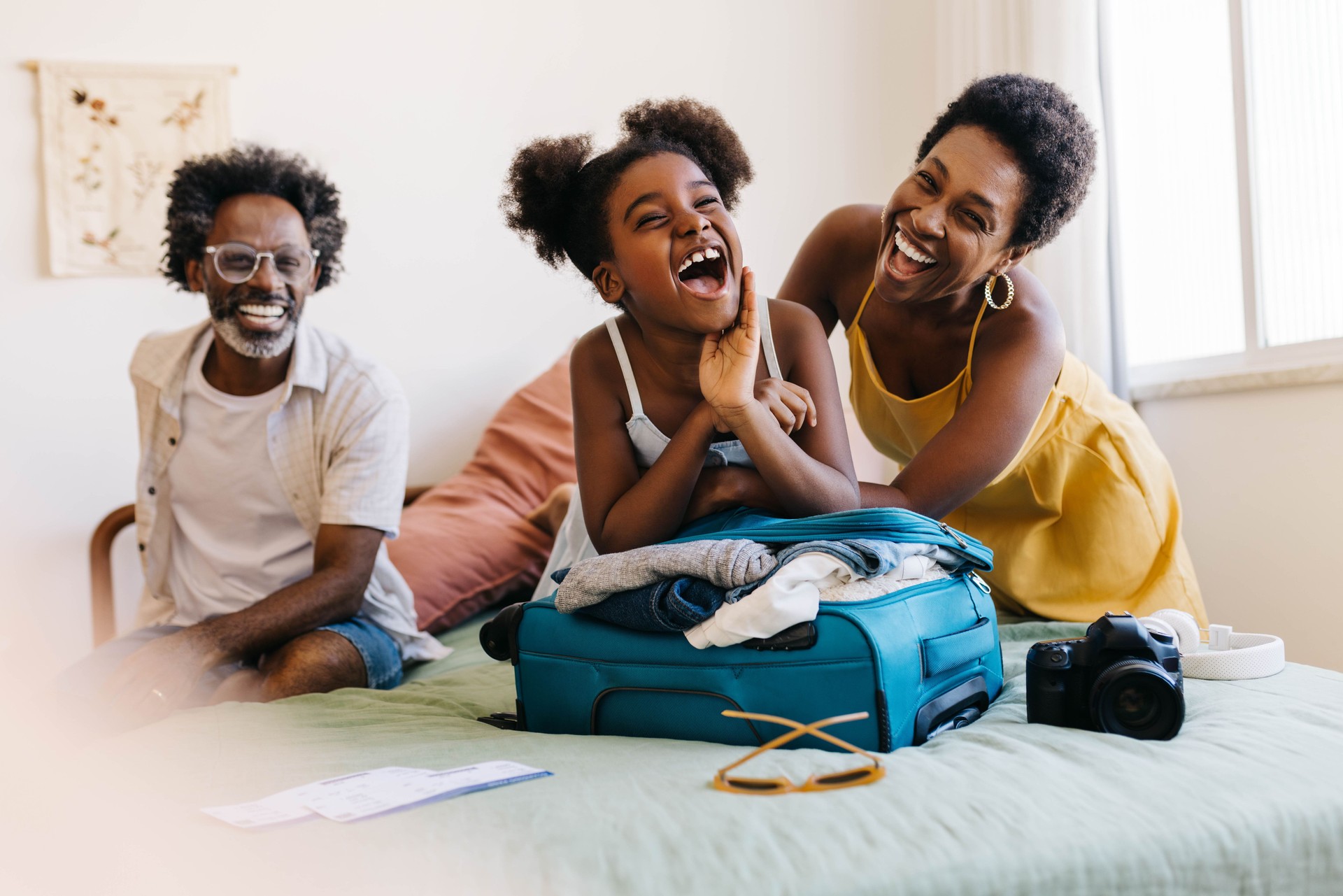 Excited family vacation: Mom and daughter packing for fun-filled getaway